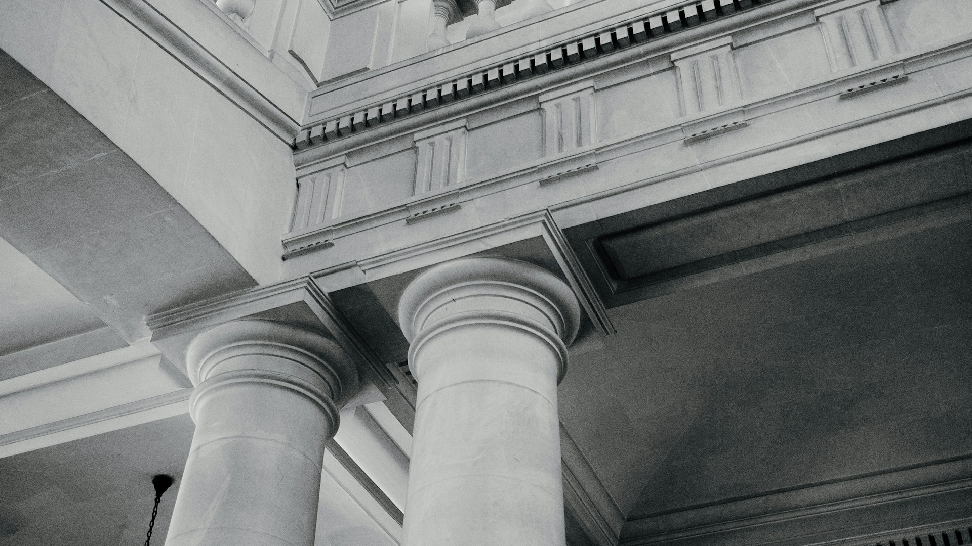 Architectural columns and molding are visible.